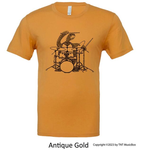 Turtle playing drums on an Antique Gold shirt.