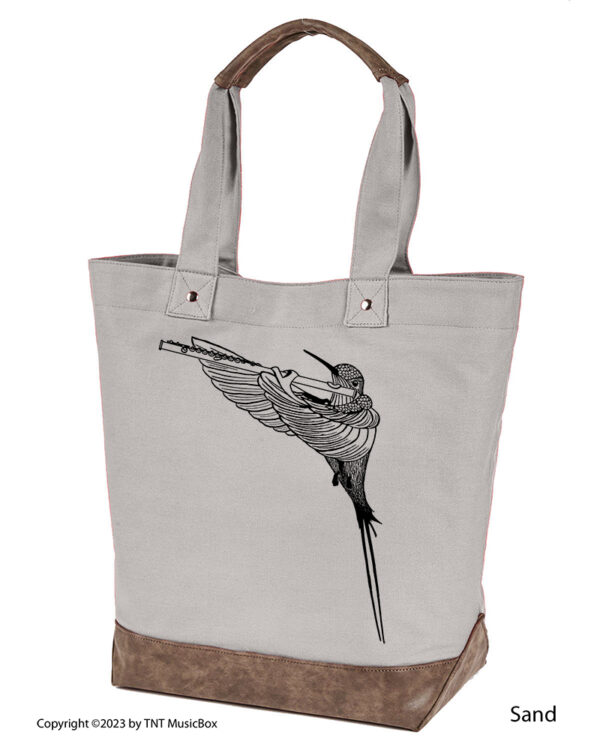 Hummingbird Playing Flute graphic on Sand colored 14oz. canvas tote. Comes Cotton lined with zippered pocket and magnetic snap closure.