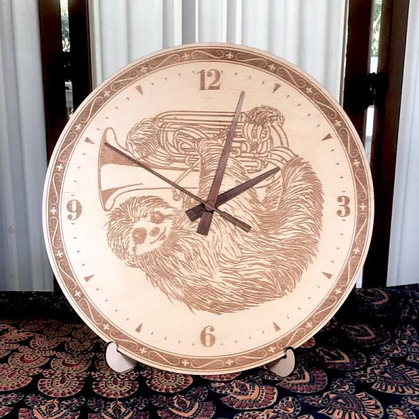 Sloth Playing Tuba Wall Clock. Laser engraved, 11.5" in diameter. 6mm Baltic Birch.