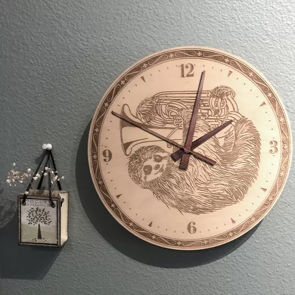 Sloth Playing Tuba Wall Clock. Laser engraved, 11.5" in diameter. 6mm Baltic Birch.